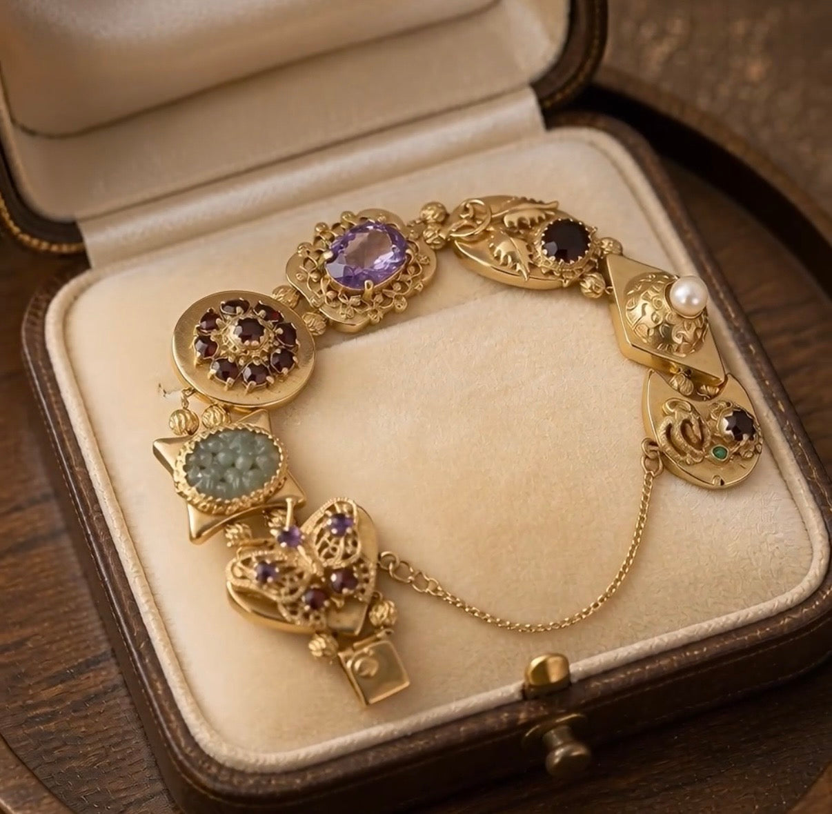 Vintage Jewelry Large 14 kt gold slide bracelet with multiple gem stones including pearls, garnets, jade, amethyst