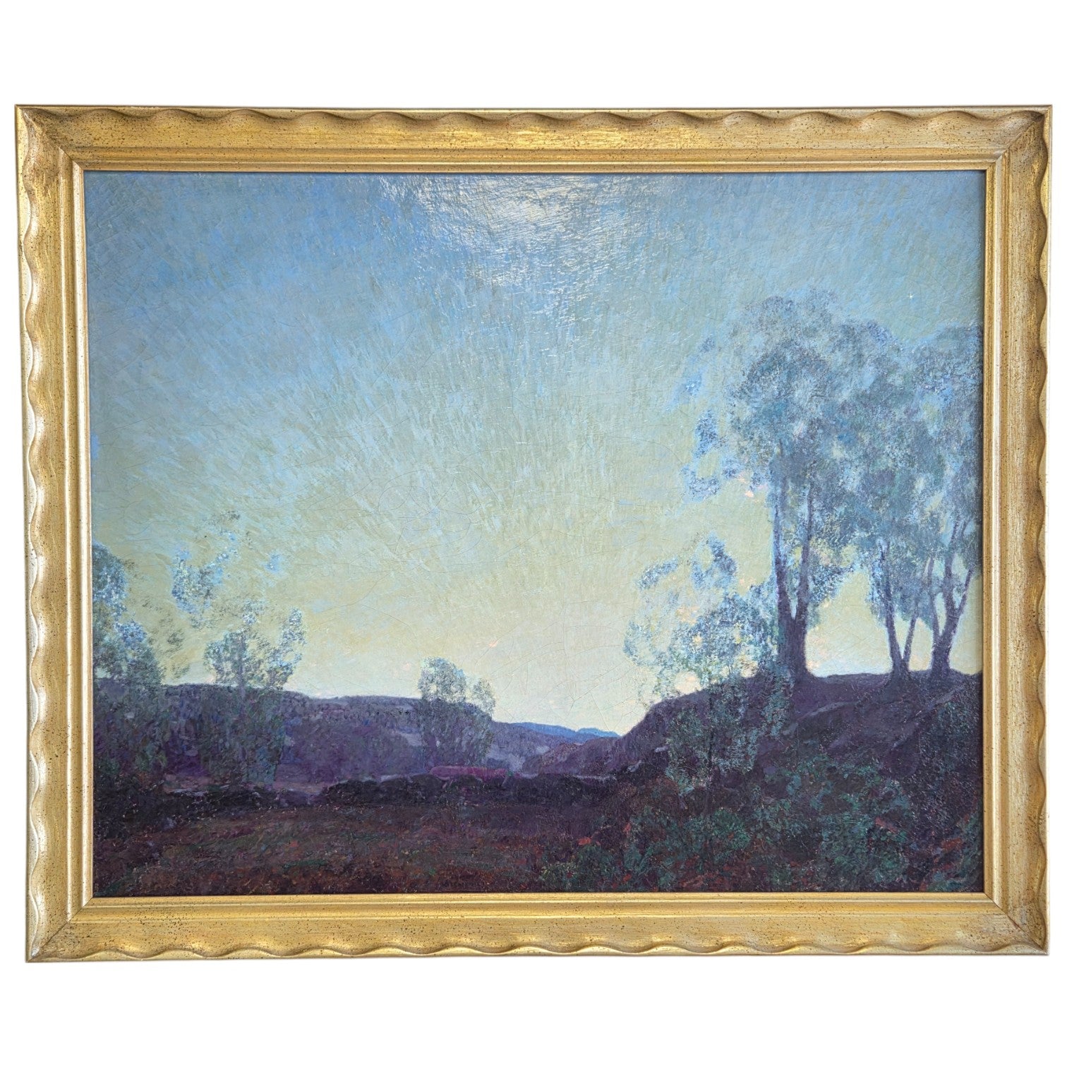 Painting of a landscape with trees and a gold frame